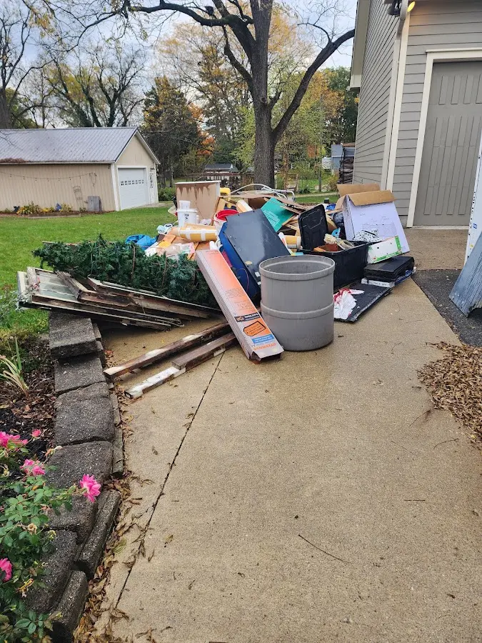 Dumpster being loaded with debris for 10 Yard Dumpster Rental in Chester Heights